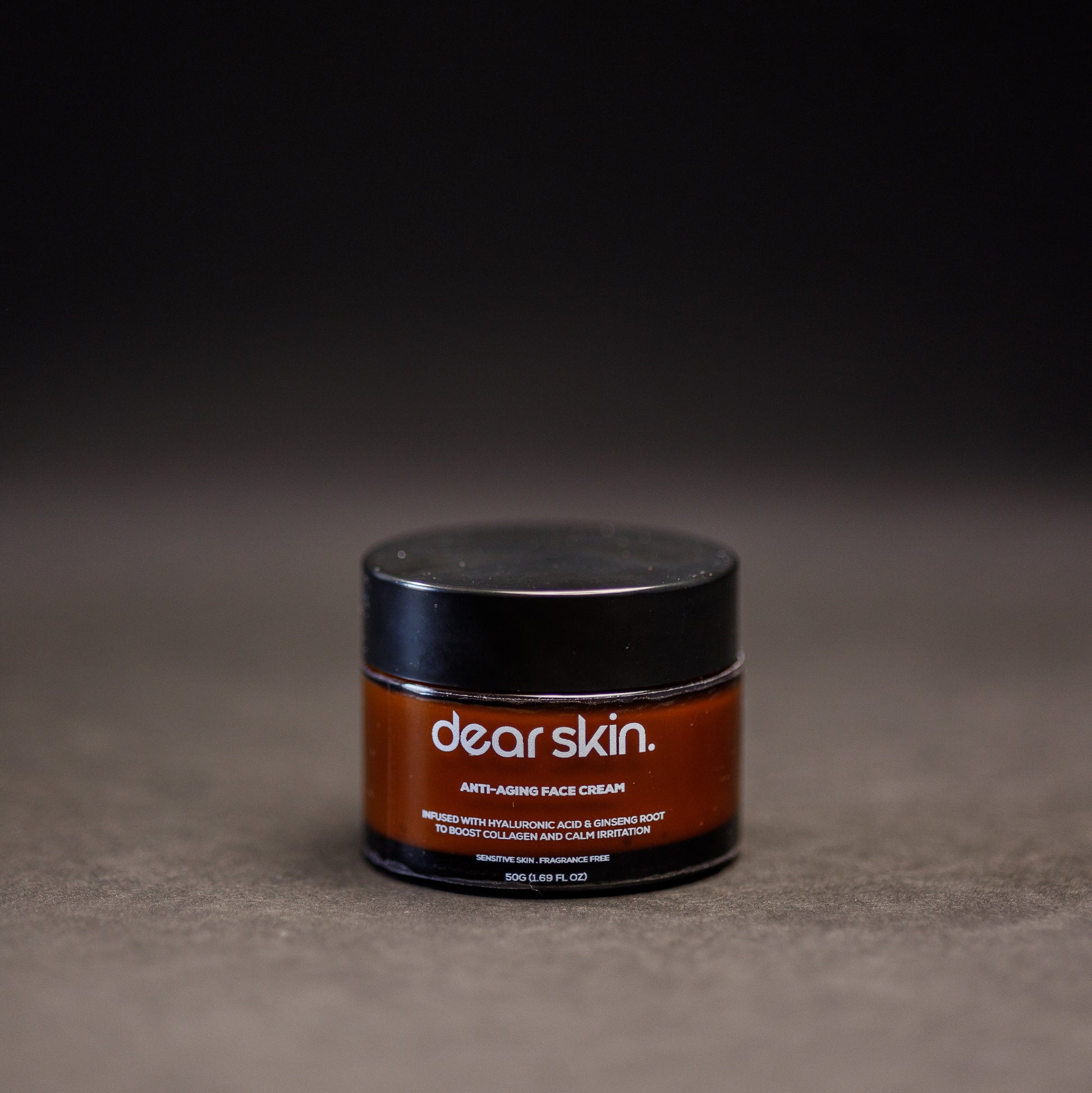 Dear Skin Anti-aging Face Cream in a sleek pump bottle, enriched with ginseng root and hyaluronic acid for firm, radiant skin.