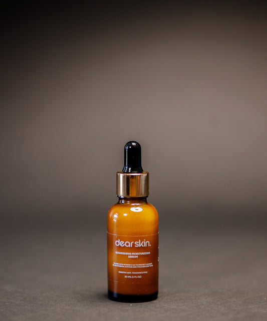 Dear Skin Nourishing Moisturizing Serum in a 30ml amber glass bottle, powered by Vitamin C, aloe vera, and baobab oil for radiant, hydrated skin.