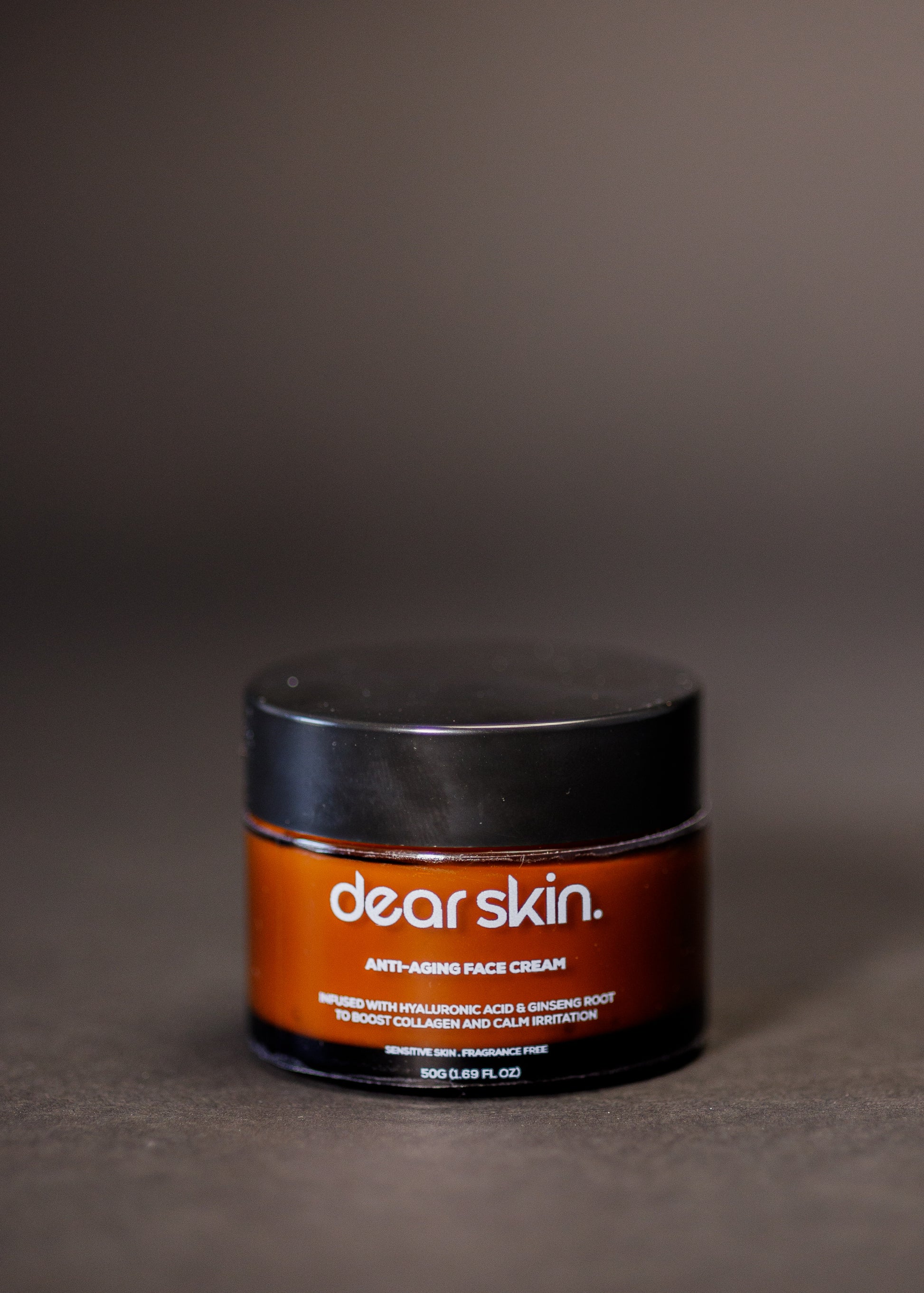 Dear Skin Anti-aging Face Cream in a sleek pump bottle, enriched with ginseng root and hyaluronic acid for firm, radiant skin.